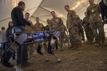 Jiren Parikh, Ghost Robotics CEO, briefs service members on the capabilities of the company's Robodogs during the Advanced Battle Management System demonstration in 2019. The company develops the robots for commercial and military applications. (Tech. Sgt. Joshua J. Garcia/U.S. Air Force)