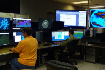 U.S. Navy operators at Pearl Harbor, HI, view satellite imagery at the Joint Typhoon Warning Center. Credit: U.S. Navy