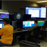 U.S. Navy operators at Pearl Harbor, HI, view satellite imagery at the Joint Typhoon Warning Center. Credit: U.S. Navy